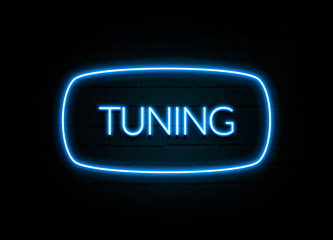 Tuning  - colorful Neon Sign on brickwall