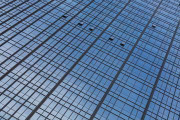 Urban abstract - windowed corner of office building.