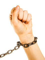 Chained man hands with chain around wrists