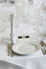 Detailed closeup of tableware, cuttlery and wedding decorations