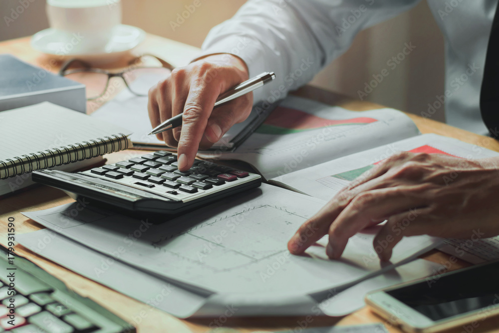 Poster accountant working on desk office with using a calculator finance accounting concept