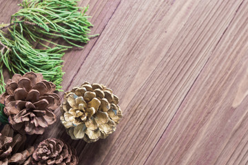 Pine cones ,Christmas party accessories on wooden table