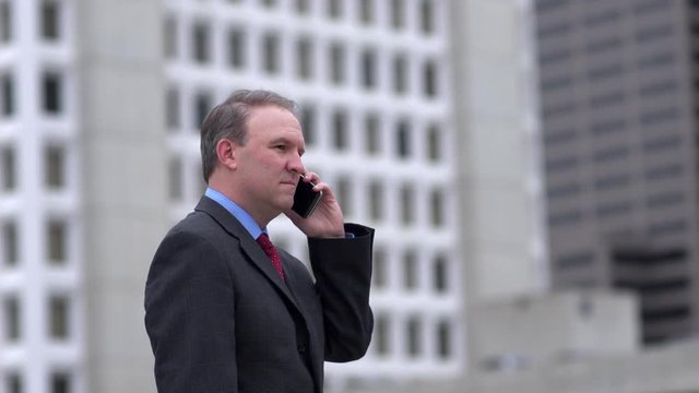Businessman getting good news on the phone