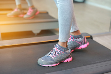 Close up Foot of fitness girl running on track.