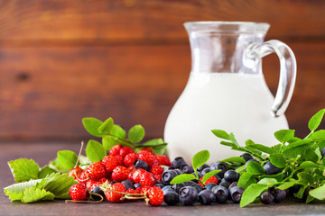 Forest berries and milk. Selective focus