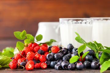 Forest berries and milk. Selective focus