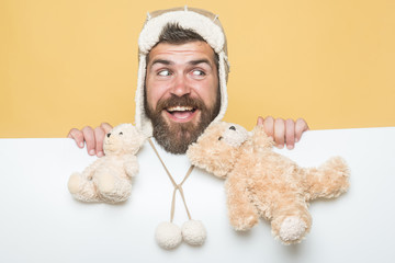 Hipster with toy on yellow white background