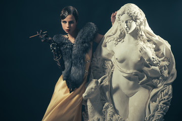 Woman with retro hair, makeup and cigarette holder.