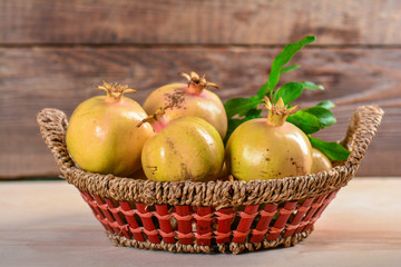 Pomegranates in a wicker basket