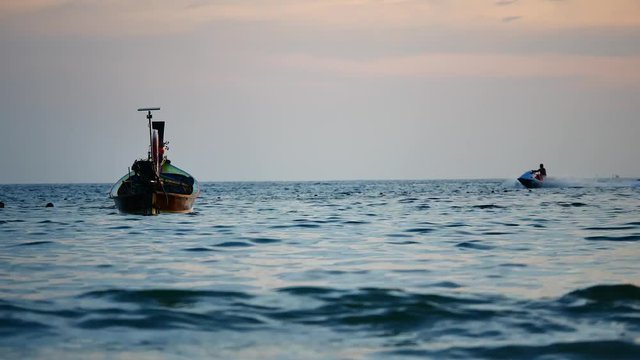Travel Video In the high season. Long-tail boats converted boat excursions. In order to serve tourists cruising the island.The Andaman Sea coast. in travel and transportation concept.
