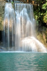 Fototapeta na wymiar Details of beautiful waterfall, Erawan waterfall is famous waterfall in Erawan national Park, Kanchanaburi province, Thailand.