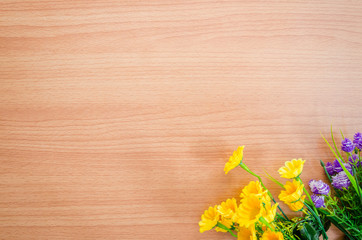 Flowers on wooden background