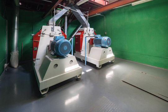 Rotary hammer mills for grinding wheat and barley grain. 