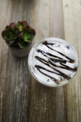 Iced mocha coffee on wooden table
