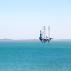  an off shore platform in the clear ocean