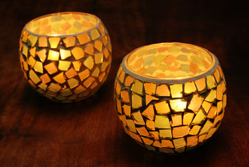 Candlestick on the table on black background