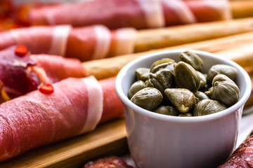 Bowl of capers, italian antipasti, traditional food from italy or mediterranean cuisine ingredient