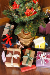 Christmas tree with many ccolorful gifts