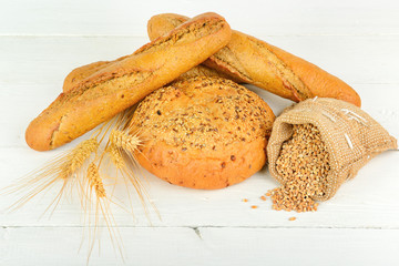 fresh bread and wheat on the wooden