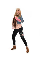 Fototapeta premium full length portrait of a cute girl wearing fall fashion, standing pose on white background.