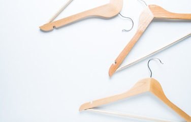 Wooden hanger on white background