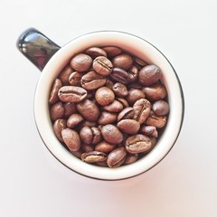Coffee beans in a cup