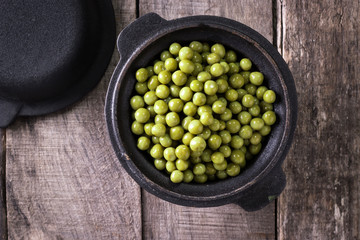 canned Green peas l on old wooden background,healthy vegan food