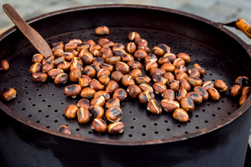roasted chestnuts for sale on a market
