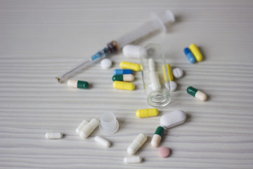 medical ampoule, bottle, pills and syringe