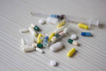 medical ampoule, bottle, pills and syringe