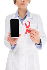 doctor with smartphone and aids ribbon