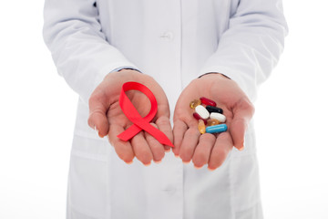 doctor with aids ribbon and pills