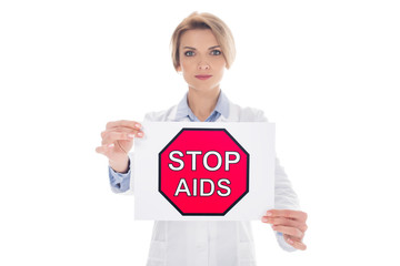 doctor with stop aids placard