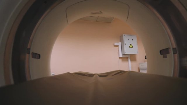 Hospital, view of magnetic resonance imaging, movement on the tunnel.
