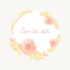 Wedding invitation card with flowers on polka dot background.