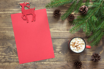 Christmas composition with red cup and empty red blank letter for Santa or your wishlist or advent activities.