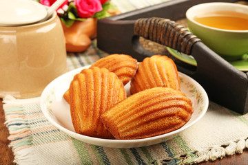 Madeleine cookie and cup of tea.