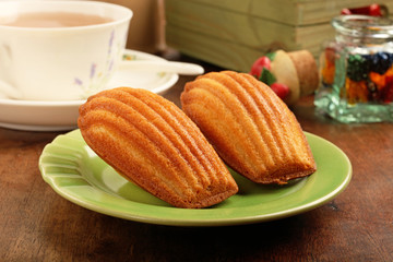 Madeleine cookies on wooden table  
