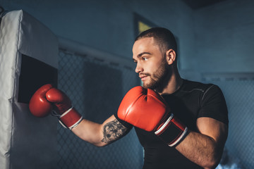 muscular sportsman in boxing gloves