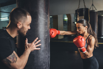 trainer and female boxer - Powered by Adobe