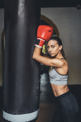 female boxer with punching bag