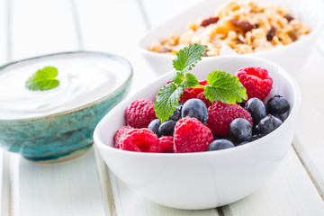 Muesli yoghurt and berries. Healthy breakfast with yogurt granola and fresh fruit
