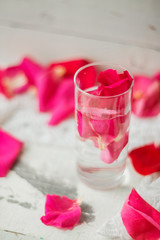 Rose petals in a bowl of water