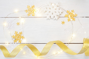 christmas or new year composition. christmas gifts and decorations in gold colors on white background. holiday and celebration concept for postcard or invitation. flat lay. top view