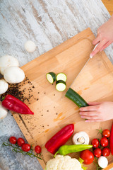 A woman's hand with vegetables