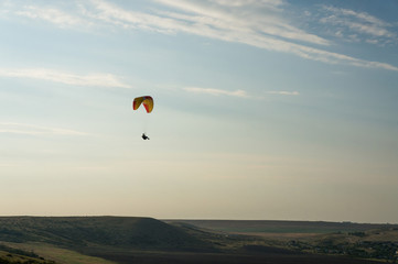 person flying on paraplane