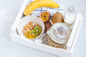 Healthy breakfast: muesli, yoghurt, fruit in a white box