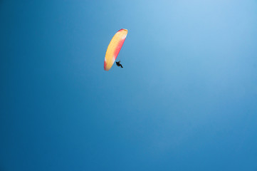man flying on paraglider