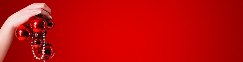 Red Christmas Banner With Hand And Christmas Balls New Year