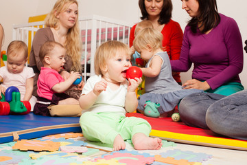 Group of mothers with their babies